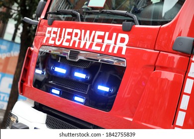 German fire engine in action with alarm light / Feuerwehr means Fire Department