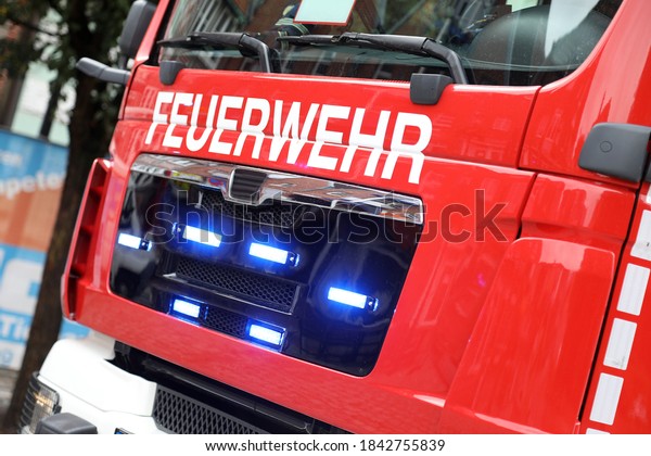German fire engine in action with alarm light\
/ Feuerwehr means Fire\
Department