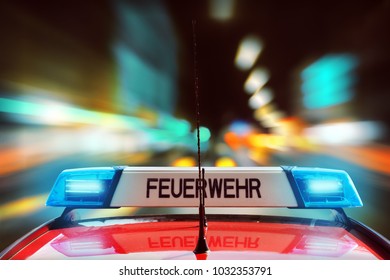 German Fire Engine On The Street At Night, Feuerwehr Is The German Word For Fire Department