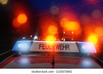 German Fire Engine On The Street At Night, Feuerwehr Is The German Word For Fire Department