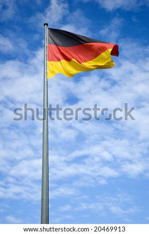 Similar – Waving German flag in front of a blue sky with clouds, Hallig Oland in the background