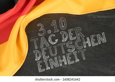 German Flag And German Translation For The Holiday Of German Reunification