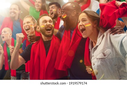 German football, soccer fans cheering their team with a red scarfs at stadium. Excited fans cheering a goal, supporting favourite players. Concept of sport, human emotions, entertainment. - Shutterstock ID 1919579174