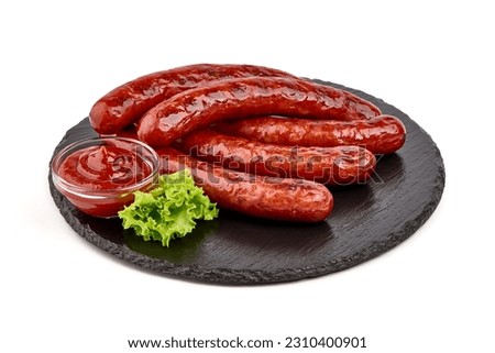 German grilled pork sausages with tomato sauce, close-up, isolated on white background