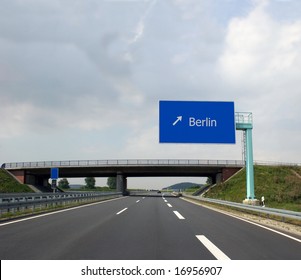 German Highway (Autobahn) And Direction Sign To The Captital Berlin