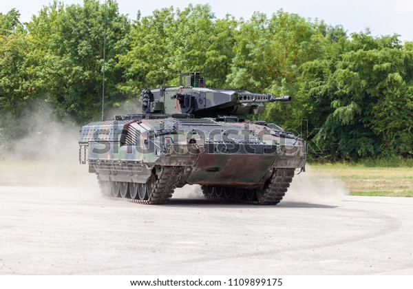 German\
infantry fighting vehicle drives on a\
street