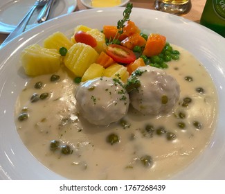 German Meatballs In Cream Caper Sauce With Boiled Potatoes And Peas And Carrots. Called Königsberger Klopse