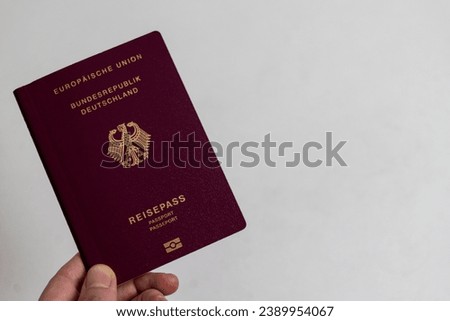 German passport on the white table, gray background