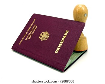 A German Passport & Rubber Stamp On A White Background