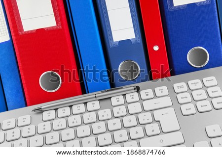 German PC keyboard and file folders