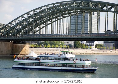 German people and foreigner travelers journey by ferry boat across in rhine river at Hohenzollern bridge on September 10, 2019 in Cologne, Germany