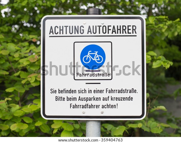 German sign that says:\
Attention car drivers. You are in a bicycle road. Pay attention to\
cyclists.