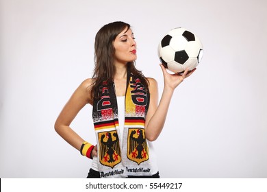 German Soccer Fan Girl Looking At The Ball In Her Hand