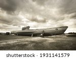 German submarine U-995. Dramatic sky, storm clouds. Museum ship, Laboe Naval Memorial. Germany. Panoramic view, sepia image effect. Landmarks, sightseeing, history, past, war, WW2, nautical vessel