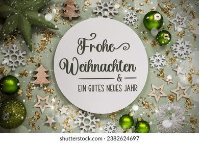 German Text Frohe Weihnachten Und Ein Gutes Neues Jahr, Means Merry Christmas And Happy New Year In English, Winter Flatlay, Green Christmas Decoration, Background With Snow - Powered by Shutterstock