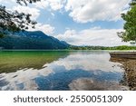 german village -Hopfen am See- Hopfen lake in summer with mountain background. Bavarian town , Füssen, Swabian,Ostallgäu. Air and Kneipp spa resort