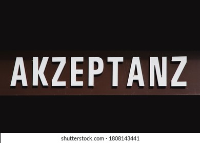 German Word Akzeptanz - Acceptability - On Dark Background. Concept Of Esteem And Ensure Societal Acceptance, Fighting Against Racism, Prejudice, Discrimination And Racialism