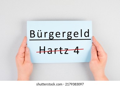 The german word for citizen money is standing on a paper, Hartz 4 is crossed out, new financial help system for unemployment in Germany, social issue