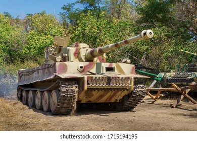 German World War II Heavy Tank The Tiger Goes On A Glade In A Sunny Forest.