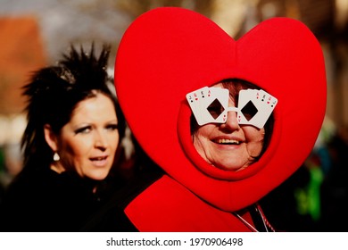 Germany, Augsburg - March 3, 2014: German Carnival Parade Participant Dressed In A Costume As The Queen Of Hearts From A Deck Of Cards