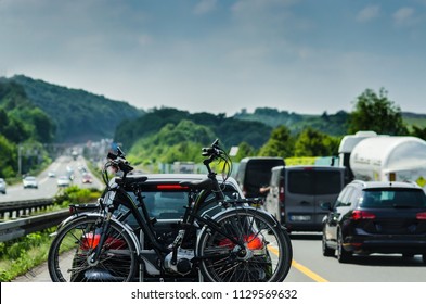 Germany Autobahn Traffic. Car With Bike Rack.