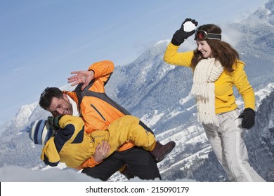 Germany, Bavaria, Family Having Snowball Fight