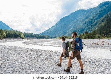 Germany- bavaria- two hikers walking in dry creek bed - Powered by Shutterstock