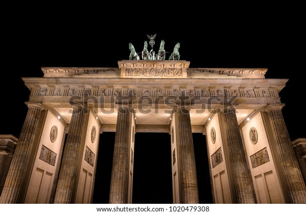 Germany, Berlin, Pariser Platz: Illuminated Brandenburg\
Gate (Brandenburger Tor) and Quadriga at dark night in the German\
capital. The monument was built by king Frederick William II -\
isolated 