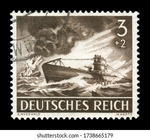 GERMANY - CIRCA 1943: German historical stamp: u-boat type VII A, the most common submarine Kriegsmarine, the enemy ship is burning and sinking, Wehrmacht, memorial day 43
