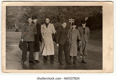 GERMANY - CIRCA 1950s: Vintage Photo Shows Group Of Boys (students) Go To The School. Retro Black & White Photography.