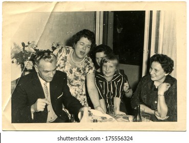 GERMANY -  CIRCA 1960s: An Antique Photo Shows Family Party