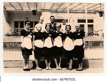 GERMANY, CIRCA 1960s: Vintage Photo Shows Hotel Staff In Front Of Hotel, Circa 1960s.