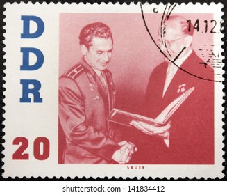 GERMANY - CIRCA 1961: A Stamp Printed By Germany Shows Portrait Of Soviet Cosmonaut Gherman Titov And Chairman Of The State Council Of The German Democratic Republic Walter Ulbricht, Circa 1961