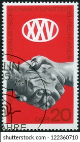 GERMANY- CIRCA 1971: A Stamp Printed In Germany Shows Clasped Hands, 25th Anniversary Of Socialist Unity Party Of Germany (SED), Circa 1971