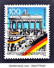 Germany - Circa 1990 : Cancelled Postage Stamp Printed By Germany, That Shows Brandenburg Gate And Crowd, Celebrating First Anniversary Of Opening Of Berlin Wall, Circa 1990.