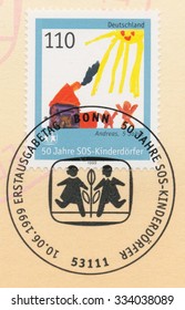 GERMANY - CIRCA 1999: A Post Stamp Printed In Germany Shows Picture SOS Childrenâ??s Village, 50th Anniversary, Circa 1999