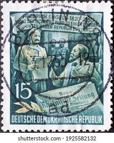 GERMANY, DDR - CIRCA 1955 : A Postage Stamp From Germany, GDR Showing A Portrait Of Friedrich Engels As Editor Of The New Rheinische Newspaper. Text: 60th Anniversary Of Friedrich Engels' Death 