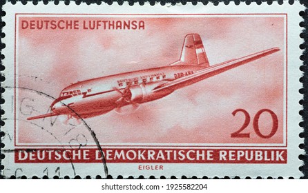 GERMANY, DDR - CIRCA 1956  : A Postage Stamp From Germany, GDR Showing A Russian Aircraft Ilyushin Il-14 (Il 14) Of Lufthansa In Flight From The Right. Opening Of Civil Aviation In The GDR 