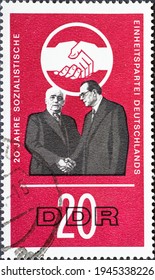 GERMANY, DDR - CIRCA 1966  : A Postage Stamp From Germany, GDR Showing The Symbolic Handshake Between Wilhelm Pieck (KPD) And Otto Grotewohl (SPD). Handshake Emblem 