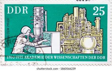 GERMANY, DDR - CIRCA 1975  : A Postage Stamp From Germany, GDR Showing An Electron Microscope And Chemical Plant In Theory And Practice. 275 Years Of The Academy Of Sciences, Berlin