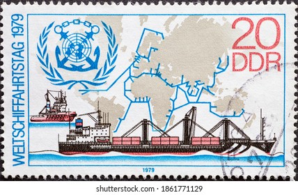 GERMANY, DDR - CIRCA 1979 : a postage stamp from Germany, GDR showing the container ship "Meridian", tug, emblem of the IMC. World Shipping Day