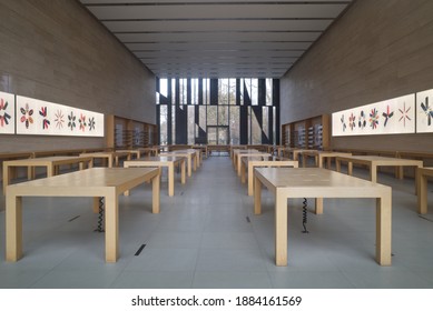 DÜSSELDORF, GERMANY -DECEMBER 2020: Interior view of empty apple store without displaying products and people which is closed during lockdown by COVID-19 in Düsseldorf, Germany.