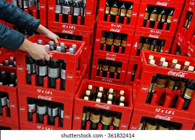 GERMANY - DECEMBER 21: Stack Of Crates Coca-Cola Soft Drinks Bottles In A Kaufland Hypermarket. The Coca-Cola Company Is An American Multinational Corporation. Taken On December 21, 2015 In Germany