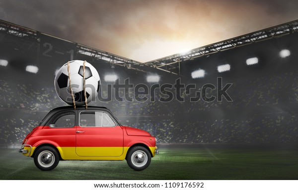 Germany flag on car delivering soccer or football\
ball at stadium