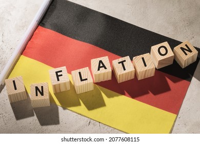 Germany Flag And Wooden Cubes With Text, Concept On The Theme Of Inflation In The Country