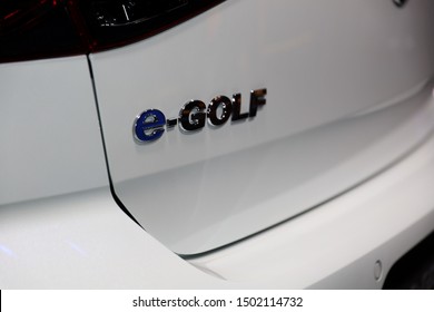 Germany, Frankfurt - 10.September 2019: Volkswagen VW e-Golf, automatic electric car  ,detail view of the car body with VW e-Golf logo -  IAA Car Show Frankfurt 2019