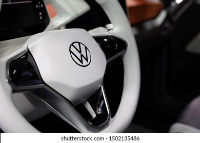 Germany, Frankfurt - 10.September 2019: Volkswagen VW ID.3, VW electric car  ,detail view of steering wheel with controls and company logo - IAA Car Show Frankfurt 2019