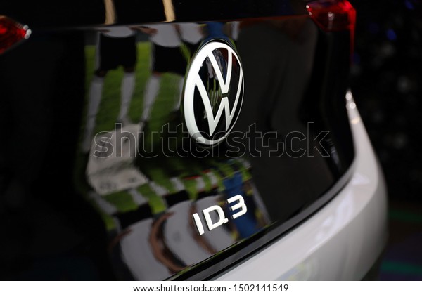 Germany, Frankfurt - 10.September
2019: Volkswagen VW ID.3, VW electric car  ,detail view of the car
body with VW logo and ID.3 Text -  IAA Car Show Frankfurt
2019