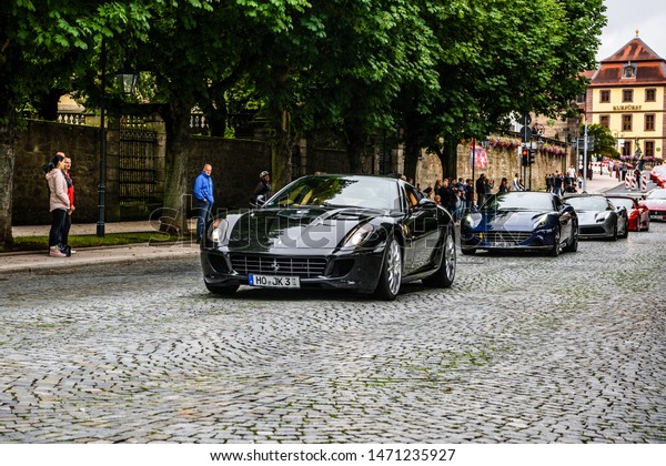 GERMANY, FULDA - JUL 2019: black FERRARI\
CALIFORNIA Type F149 coupe is a grand touring sports car produced\
by the Italian automotive manufacturer Ferrari. It is a two-door\
hard top convertible.