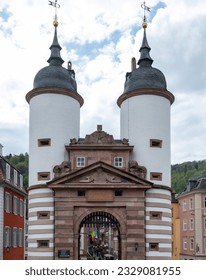 Germany, Heidelberg city. Karl Theodor Old Bridge with large arched Gate between two white Tower. Historical famous monument from Middle Age. - Shutterstock ID 2329081955